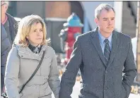 ?? ANDREW VAUGHAN / THE CANADIAN PRESS ?? Dennis Oland and his wife Lisa head to the Law Courts in Saint John, N.B., in this CP file photo.