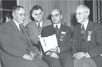  ?? THE COMMERCIAL APPEAL FILES ?? Dr. Ben E. Goodrich, second right, dealt with clinical problems related to high blood pressure within the lungs on Feb. 13 1951 in his talk before the Mid-south Post-graduate Medical Assembly. Discussing his paper with him are Dr. N.B. Ellis, left, of Wilson, Ark.; Dr. W.H. Lunceford of Sardis, Miss., and Dr. William Britt Burns of Memphis. Dr. Burns was vice president of the old Tri-state Medical Assembly in 1898, which preceded the present organizati­on. He maintains he hasn't missed a single meeting throughout the years.