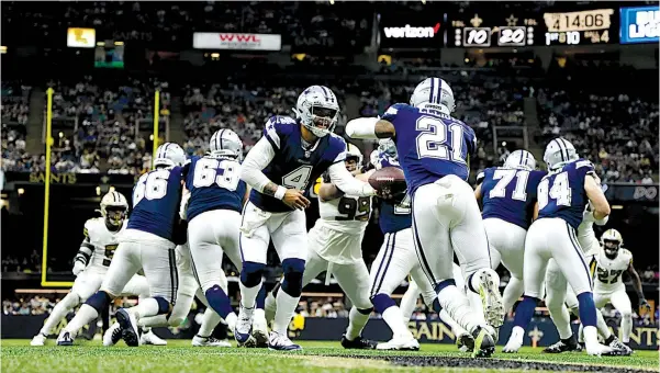  ?? Associated Press ?? The Dallas Cowboys play during the second half Dec. 2 against the New Orleans Saints in New Orleans. A division that was won by Washington in 2020 with a 7-9 record will be up for grabs — with even Philadelph­ia in the mix — should the Cowboys falter this week.