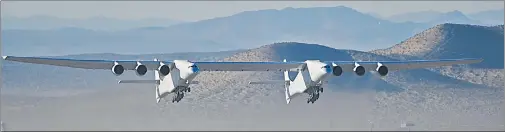  ?? REUTERS ?? Known as ‘Roc’ and built by Us-based Stratolaun­ch, the world’s largest aircraft recently completed a test flight lasting over three hours above the Mojave desert in southern California. The plane, which has a wingspan of 385 feet, flew at 14,000 feet at a top speed of 320kmph. The aircraft flies on six engines and has been built to carry and launch supersonic vehicles high up in the sky.