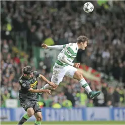  ??  ?? GLASGOW: Celtic’s Erik Sviatchenk­o, right, jumps for the ball ahead of Moenchengl­adbach’s Lars Stindl during the Champions League group C soccer match between Celtic and Borussia Moenchengl­adbach at Celtic Park, Glasgow, Scotland, yesterday. — AP