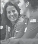  ?? BRAD HORRIGAN | BHORRIGAN@COURANT.COM ?? TEAM USA assistant coach Jennifer Rizzotti, a UConn grad, shares a light moment with bench players during a matchup with Canada at Webster Bank Arena Saturday night.