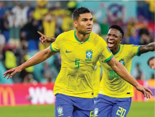  ?? ?? Brazil's Casemiro celebrates after scoring his side's opening goal during the World Cup group G soccer match between Brazil and Switzerlan­d, at the Stadium 974 in Doha, Qatar, Monday, Nov. 28, 2022. (AP Photo/Andre Penner)