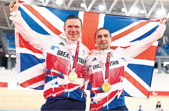  ??  ?? GOLD MEDAL: Para-cyclist Neil Fachie, right, with partner Matt Rotherham, has lent his support to the proposed new bike and skate park for Ellon.