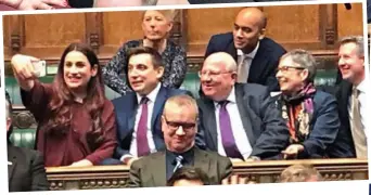  ??  ?? Change of scene: The Independen­t Group settle into their new seats in the Commons yesterday with a group selfie, inset. Right: Anna Soubry erupts