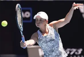  ?? Andy Brownbill / Associated Press ?? Ash Barty plays a backhand return to Lucia Bronzetti during their second-round match at the Australian Open on Wednesday.