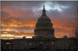  ?? J. SCOTT APPLEWHITE — THE ASSOCIATED PRESS FILE ?? The Capitol is seen at sunset in Washington. Facing criticism that the Senate has become little more than what one member calls “an expensive lunch club,” Congress returns for the fall session with pressure mounting on Leader Mitch McConnell to address gun violence, election security and other issues.