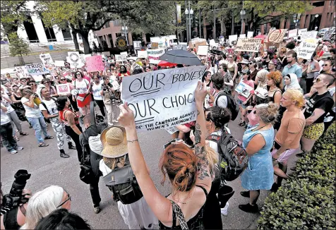  ?? MICHAEL DEMOCKER/TIMES-PICAYUNE ?? Abortion rights supporters rally in New Orleans as restrictio­ns, with no exceptions for rape or incest, are being weighed.