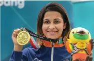  ?? PTI ?? Shooter Heena Sidhu with her bronze medal in the 10m air pistol in Palembang on Friday. —