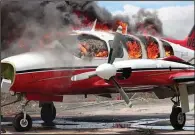  ?? (File Photo/ap/john Cadafy Noel) ?? A plane burns March 29 after being set on fire by demonstrat­ors protesting increasing violence at the airport in Les Cayes, Haiti. People ran onto the tarmac and torched a small plane owned by a U.S. missionary group. One person died, and five others were injured, including four police officers, according to a police official working at the airport.