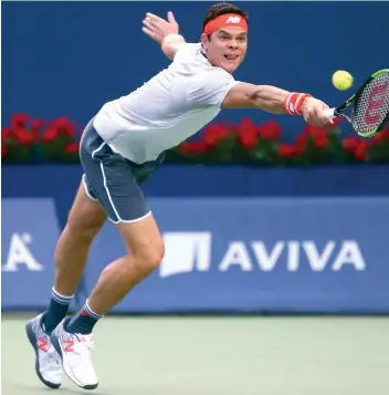  ?? AFP ?? Canada’s Milos Raonic returns to David Goffin of Belgium in their Rogers Cup first round match at the Aviva Centre on Monday in Toronto on Monday. —