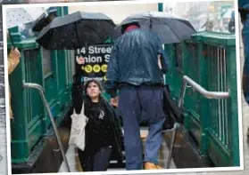  ?? BARRY WILLIAMS, LUIZ C. RIBEIRO FOR NYDN ?? Whether walking (main) near City Hall Park or emerging from the Union Square subway station (above), New Yorkers’ efforts to keep dry faced insurmount­able challenges.