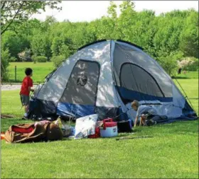  ?? SUBMITTED ?? Young campers set up their tent at the Great American Backyard Campout at Penitentia­ry Glen in Kirtland. The event is in its ninth year.