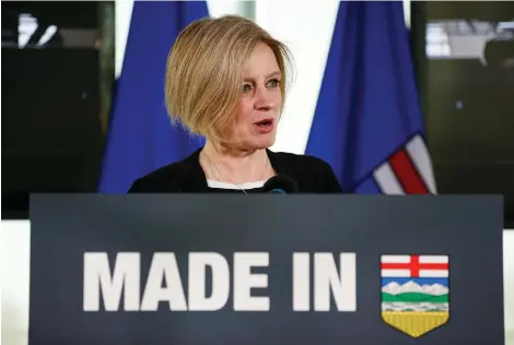  ?? IAN KUCERaK ?? Alberta Premier Rachel Notley announces her government’s rail deals with the Canadian Pacific Railway and Canadian National Railway to move more oil by rail in Edmonton on Tuesday. She said the move was necessary in order to boost prices for Canadian heavy oil.