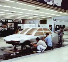  ??  ?? TOP RIGHT An early EA Falcon full-size clay makes progress in Ford's studio.