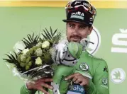  ?? THIBAULT CAMUS AP ?? Slovakia's Peter Sagan dons the green jersey for winning the sprint during the fifth stage of the Tour de France.