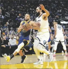  ?? TONY AVELAR/AP ?? GOLDEN STATE WARRIORS GUARD STEPHEN CURRY drives to the basket against Memphis Grizzlies center Steven Adams during the first half of Game 6 of a Western Conference playoff semifinal in San Francisco on Friday.