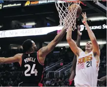  ?? RICARDO ARDUENGO/THE ASSOCIATED PRESS ?? Toronto Raptors guard Norman Powell, left, says he’s motivated by the naysayers.