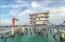  ?? PHOTOS PROVIDED TO CHINA DAILY ?? From left: Genghai No 1, off the coast of Yantai, is a largescale fish farm that makes use of artificial intelligen­ce, 5G and big data to achieve fish breeding, marine biology and research. A visitor poses for a photo at the Changyu Wine Culture Museum in Yantai, which is China’s first wine museum.