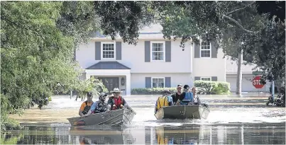  ?? Picture: Getty. ?? Residents near the Barker Reservoir, Houston, Texas, return to their flooded homes to collect belongings.