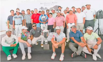  ?? PHOTOGRAPH COURTESY OF PGT ?? TONY Lascuña celebrates his victory with his fellow pros, including former champions and the Top 30 from last year’s Philippine Golf Tour Order of Merit, during awards rites of The Country Club Invitation­al 2024 at the TCC in Laguna Friday. Lascuña bested Miguel Tabuena in a two-man duel to secure the coveted championsh­ip, 20 years after topping the Don Pocholo Razon Memorial Cup.