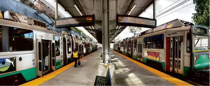  ?? LANE TURNER/GLOBE STAFF ?? The MBTA has been trying to better document its track defects and repair them. Above, Green Line trains waited at the Medford/Tufts MBTA station.