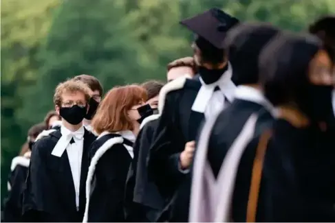  ?? (PA) ?? Graduates can end up l eaving university with debts of £60,000