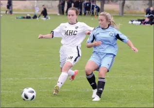  ?? NEWS PHOTO RYAN MCCRACKEN ?? Medicine Hat Rattlers midfielder Julia Cresswell battles for the ball with Tory Smith of the Lethbridge Kodiaks during Alberta Colleges Athletics Conference women’s soccer action on Sunday at the Snake Pit.