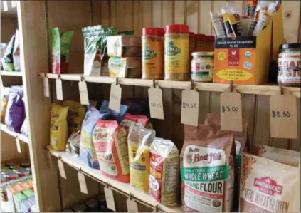  ?? PHOTOS BY MICHILEA PATTERSON — FOR DIGITAL FIRST MEDIA ?? A variety of plant-based food products are displayed on a shelf at the Firefly Café Outpost, an all-vegan grocery store in Boyertown.