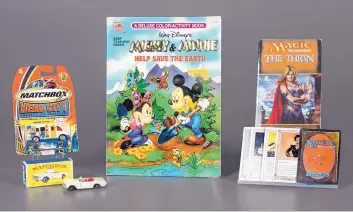  ?? NATIONAL TOY HALL OF FAME/ASSOCIATED PRESS ?? Matchbox Cars, left, the coloring book, center, and the collectibl­e card game Magic: The Gathering were inducted into the National Toy Hall of Fame in Rochester, N.Y., on Thursday. The winners were selected by a panel of judges from among 12 finalists.