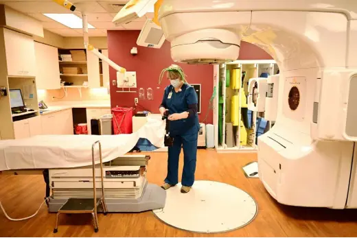  ?? Hyoung Chang, The Denver Post ?? Radiation Therapist Kristen Sherry- Taylor prepares the medical linear accelerato­r for a patient at Rocky Mountain Cancer Centers in Aurora on March 17. The Greenwood Village- based oncology operation, which has 700 employees and serves 40,000 patients annually, received $ 9.6 million from the Provider Relief Fund.