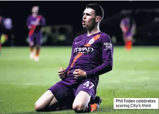  ??  ?? Phil Foden celebrates scoring City’s third