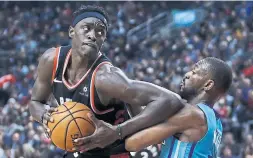  ?? VAUGHN RIDLEY GETTY IMAGES ?? Power forward Pascal Siakam, left, had the fourth-year option on his contract picked up by the Toronto Raptors on Wednesday.