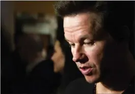  ?? CHARLES SYKES, THE ASSOCIATED PRESS ?? Boston native Mark Wahlberg really didn’t feel like attending the opening of his new movie, Pain and Gain, after the events earlier in the day in Boston.