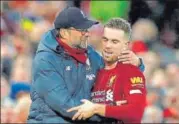  ?? REUTERS ?? Liverpool skipper Jordan Henderson, who scored the second goal n versus Southampto­n, is greeted by manager Jurgen Klopp.