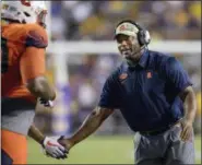  ?? MATTHEW HINTON — THE ASSOCIATED PRESS FILE ?? In this file photo, Syracuse coach Dino Babers celebrates a touchdown with his team against LSU in the second half of an NCAA college football game in Baton Rouge, La.