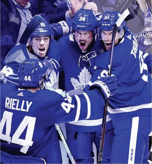  ?? FRANK GUNN
/ THE CANADIAN PRESS ?? Auston Matthews celebrates his goal with teammates in toronto’s game 3 win Monday night at Scotiabank Arena.