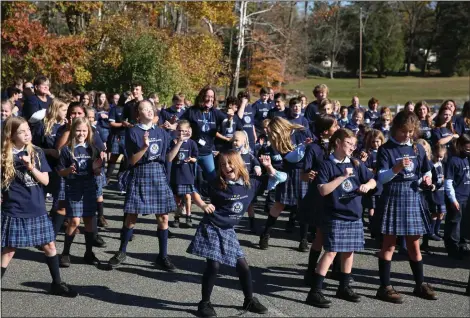  ?? COURTESY OF ST. MARY CATHOLIC SCHOOL ?? St. Mary Catholic School celebrates being named a national Blue Ribbon school with a choreograp­hed flash dance to the song “Happy” by Pharrell Williams.