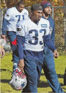  ?? STAFF PHOTO BY MATT WEST ?? IN LIMBO: Running back Dion Lewis hits the field for practice yesterday.