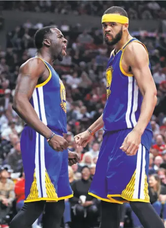  ?? Scott Strazzante / The Chronicle ?? Draymond Green greets JaVale McGee after feeding the center for a first-quarter alley-oop.