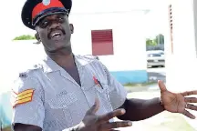  ?? EDITOR NORMAN GRINDLEY/CHIEF PHOTO ?? Sergeant Henry Parkins of the Old Harbour Bay Police Station explaining the tsunami preparatio­n that the station made.