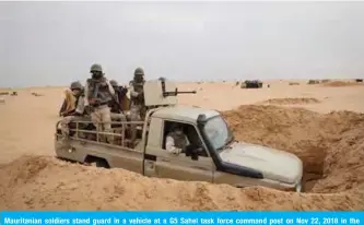  ??  ?? Mauritania­n soldiers stand guard in a vehicle at a G5 Sahel task force command post on Nov 22, 2018 in the southeast of Mauritania near the border with Mali. — AFP