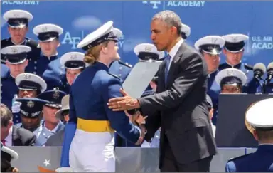  ?? CONTRIBUTE­D ?? Nicole Taylor Oniu shakes hands with President Barack Obama during her graduation from the Air Force Academy.