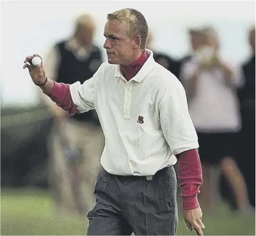  ??  ?? 0 Luke Donald acknowledg­es the crowd during a winning Walker Cup appearance for Great Britain & Ireland at Nairn in 1999