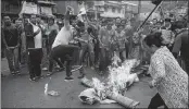  ?? AFP ?? GJM supporters burning effigy of CM Mamata Banerjee during an indefinite strike called in Darjeeling on Monday.