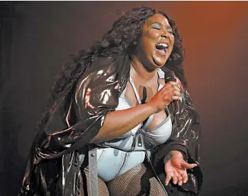  ?? JEREMY MOELLER/GETTY ?? Lizzo, seen performing on Nov. 13 in Germany, is nominated for album, record and song of the year, and new artist.