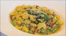  ?? Lake Fong/Post-Gazette ?? Chef Dustin Gardner makes canestri pasta with pistachio pesto, mushrooms, English peas, fava beans, sun-dried tomato and benne seeds at Casbah in Shadyside.