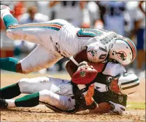  ?? FILE ?? Defensive end Kendall Langford (sacking the Jets’ Brett Favre in 2008), is back with the Dolphins hoping to prove he can still play. He was Miami’s third-round draft pick out of Hampton in 2008.