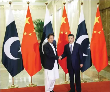  ??  ?? Chinese President Xi Jinping (right) meets Pakistan Prime Minister Imran Khan at the Great Hall of the People in Beijing (file). A delegation led by Pakistan’s finance secretary Arif Ahmed Khan and State Bank of Pakistan governor Tariq Bajwa is negotiatin­g with its Chinese counterpar­ts details of the assistance package.