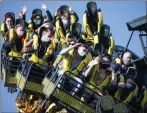  ??  ?? Thrill-seekers wear face masks at Alton Towers